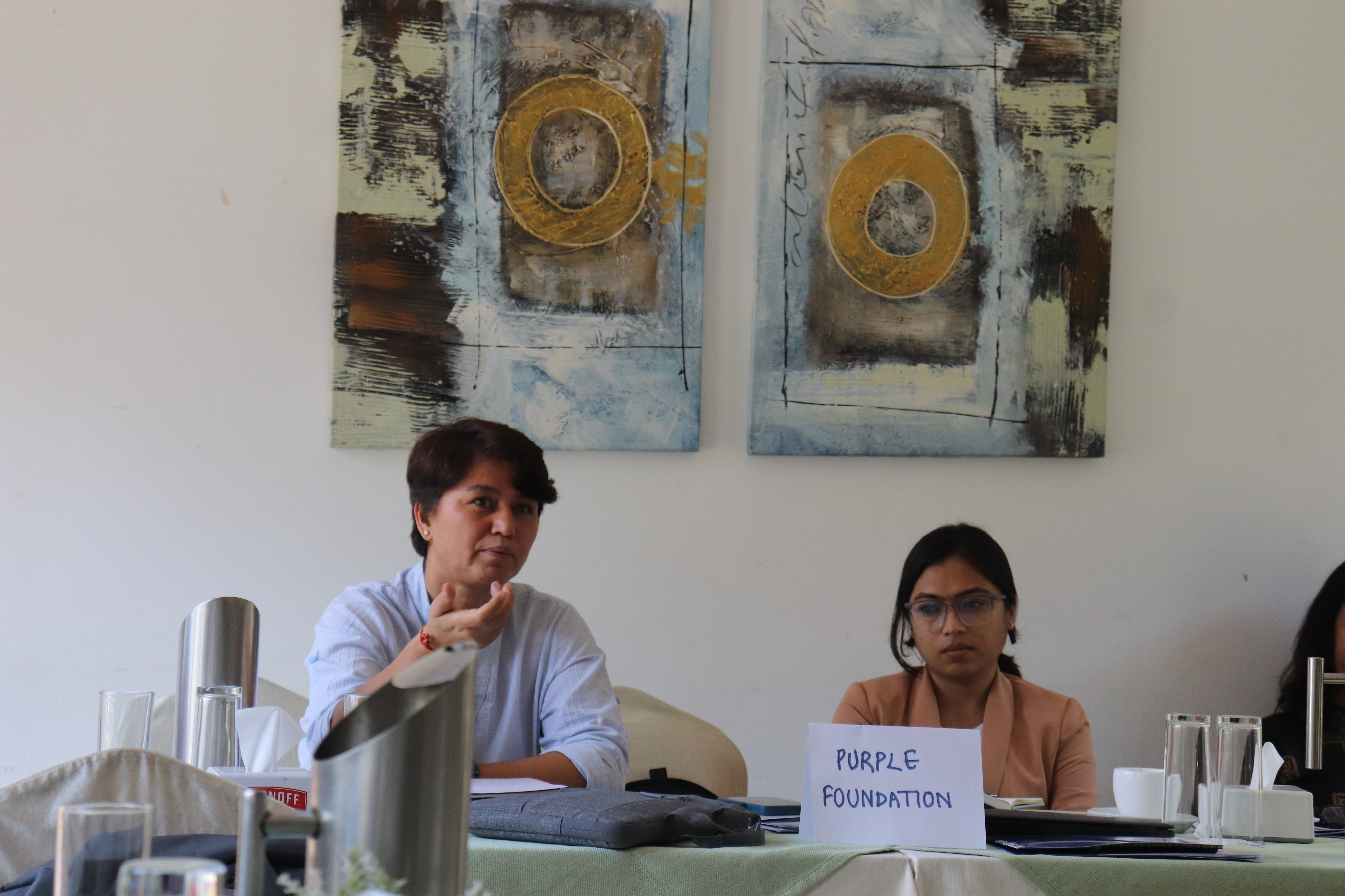 Sirjana Kafle (left), the Executive Director of Purple Foundation, speaks at an (orientation) event in Nepal on 28 September 2023 to kick off the project implementation, as Monika Paudel, a civil society organization mentor for her organization, looks on. Credit: International IDEA